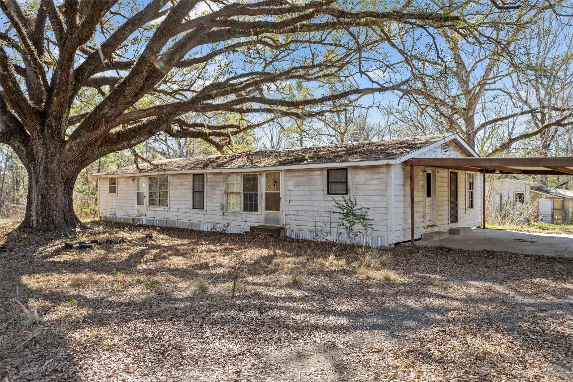 588 Linville Grimes Road Diboll, TX 75941 - Photo 20 of 30 a view of a house with a yard