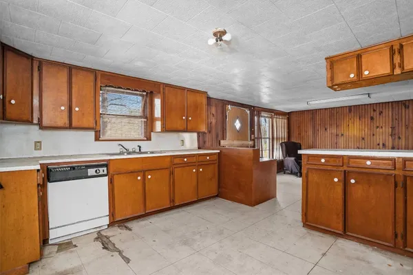 a kitchen with sink cabinets and window