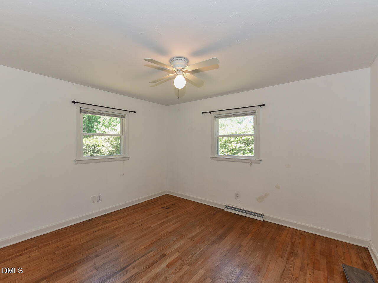 1703 St Patrick Drive Raleigh, NC 27603 - Photo 18 of 29 wooden floor in an empty room with a window