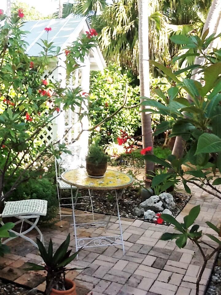 31 Boulder Drive Key West, FL 33040 - Photo 23 of 36 a view of a chairs and table in a backyard