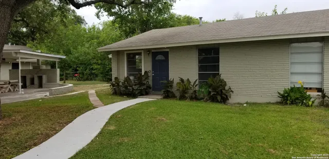 a view of a house with a yard porch and sitting area