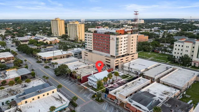 an aerial view of a city with parking