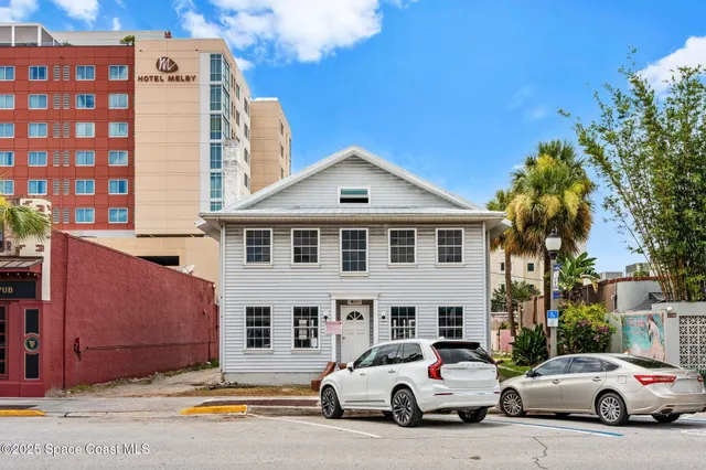 a front view of a building with street view