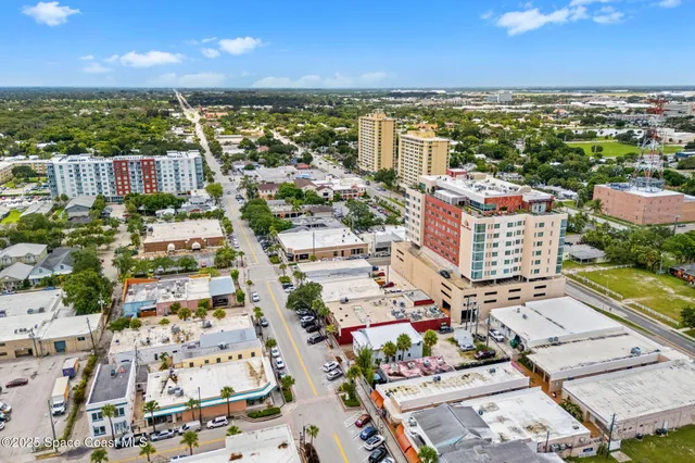 an aerial view of a building with parking