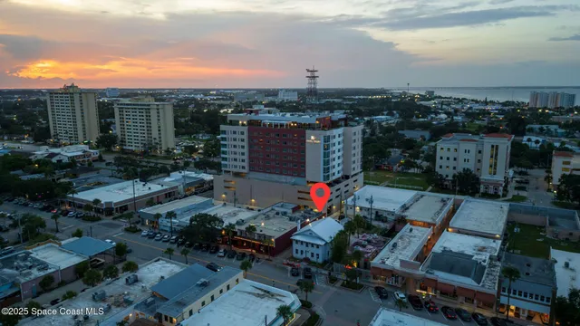 a view of a chairs and table in patio with a yard