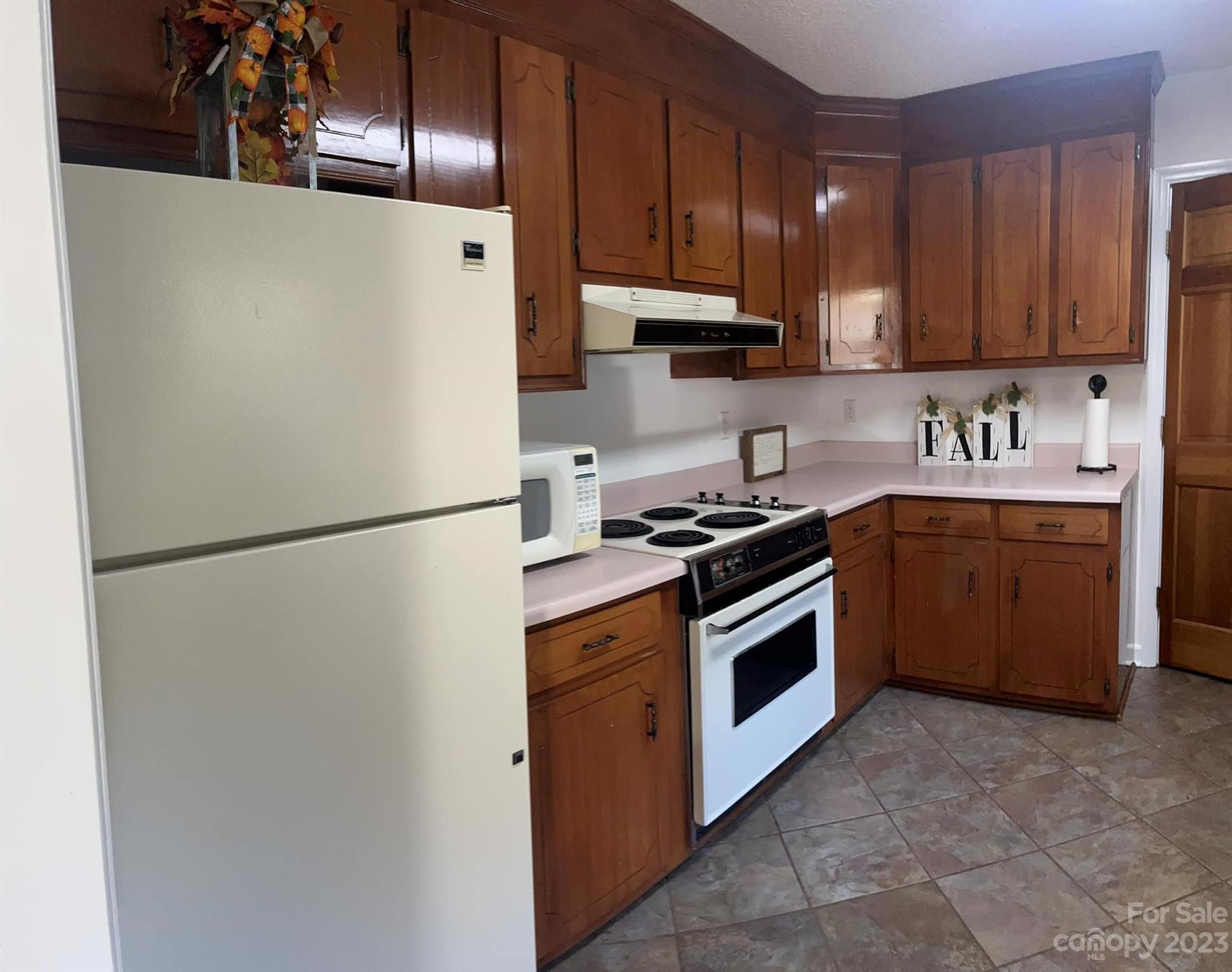20909 Highway 9 Mount Croghan, SC 29727 - Photo 11 of 21 a kitchen with a refrigerator sink and cabinets