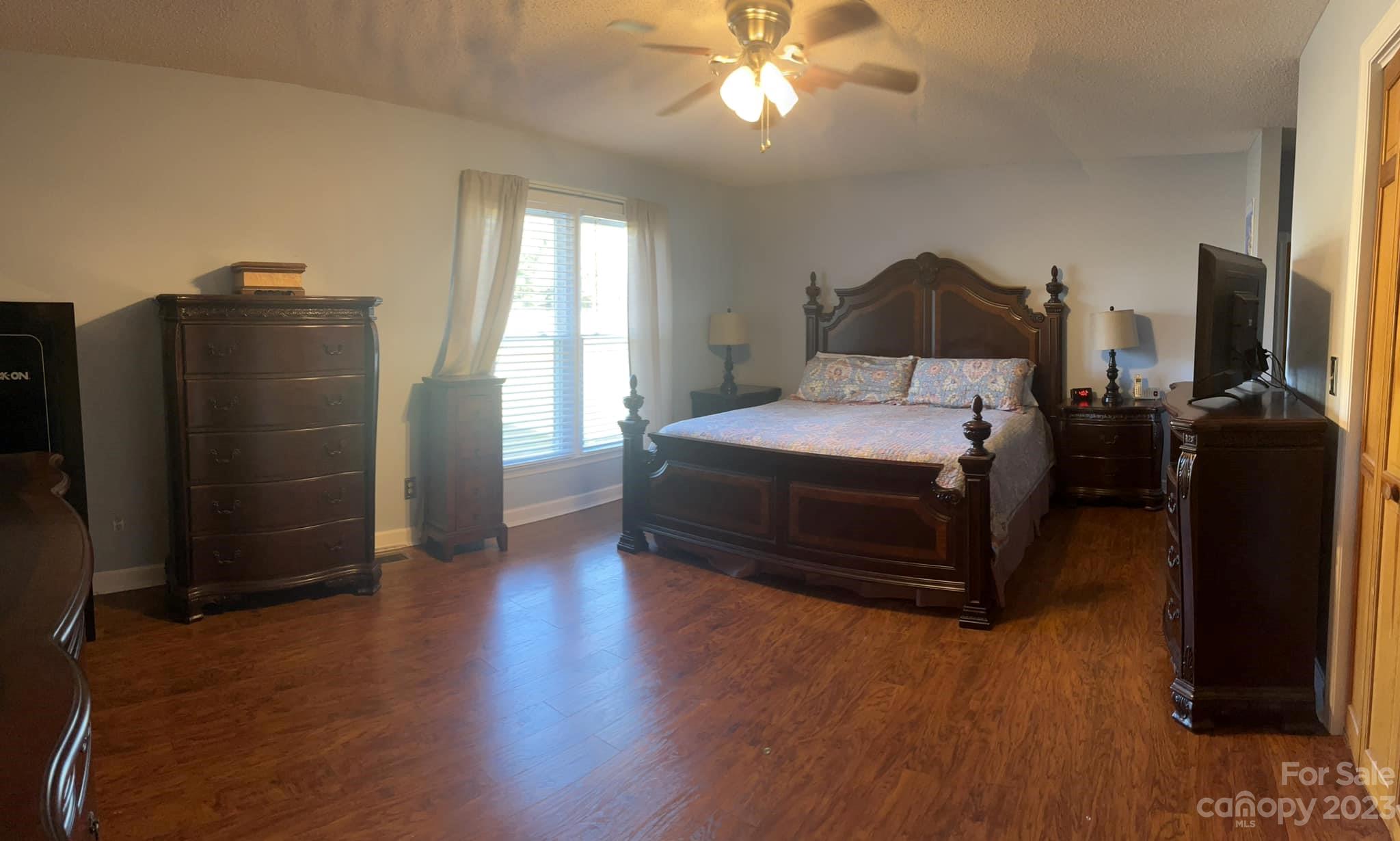 20909 Highway 9 Mount Croghan, SC 29727 - Photo 16 of 21 a bedroom with a bed and wooden floor