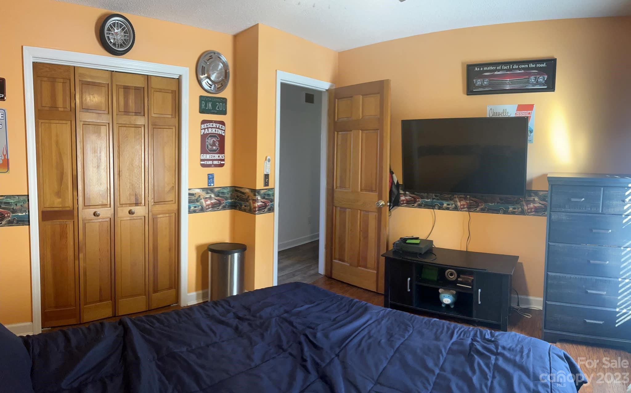 20909 Highway 9 Mount Croghan, SC 29727 - Photo 18 of 21 a bedroom with a bed and a flat screen tv
