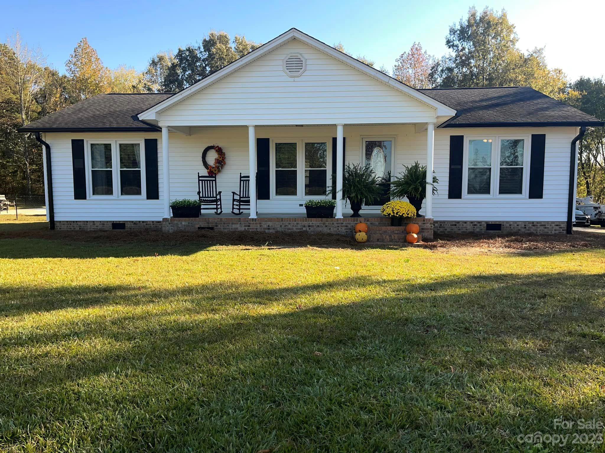 20909 Highway 9 Mount Croghan, SC 29727 - Photo 2 of 21 a view of a house with a swimming pool and a yard