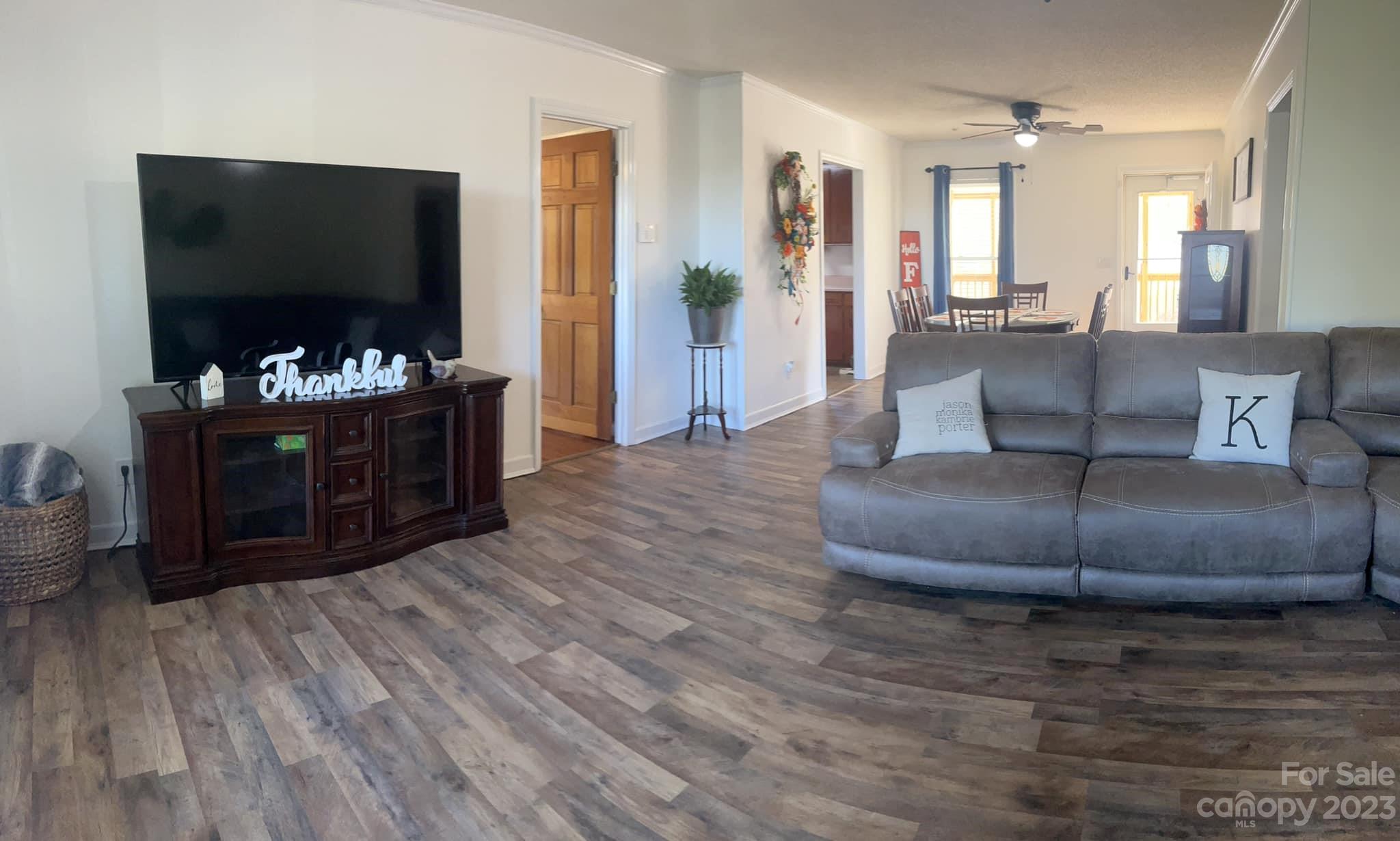 20909 Highway 9 Mount Croghan, SC 29727 - Photo 5 of 21 a living room with furniture and a flat screen tv