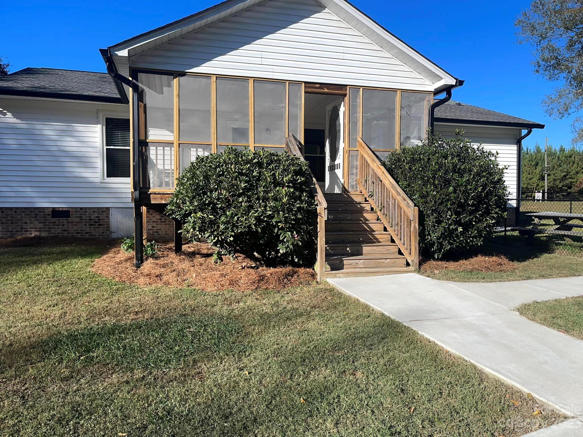 20909 Highway 9 Mount Croghan, SC 29727 - Photo 6 of 21 a front view of a house with a yard
