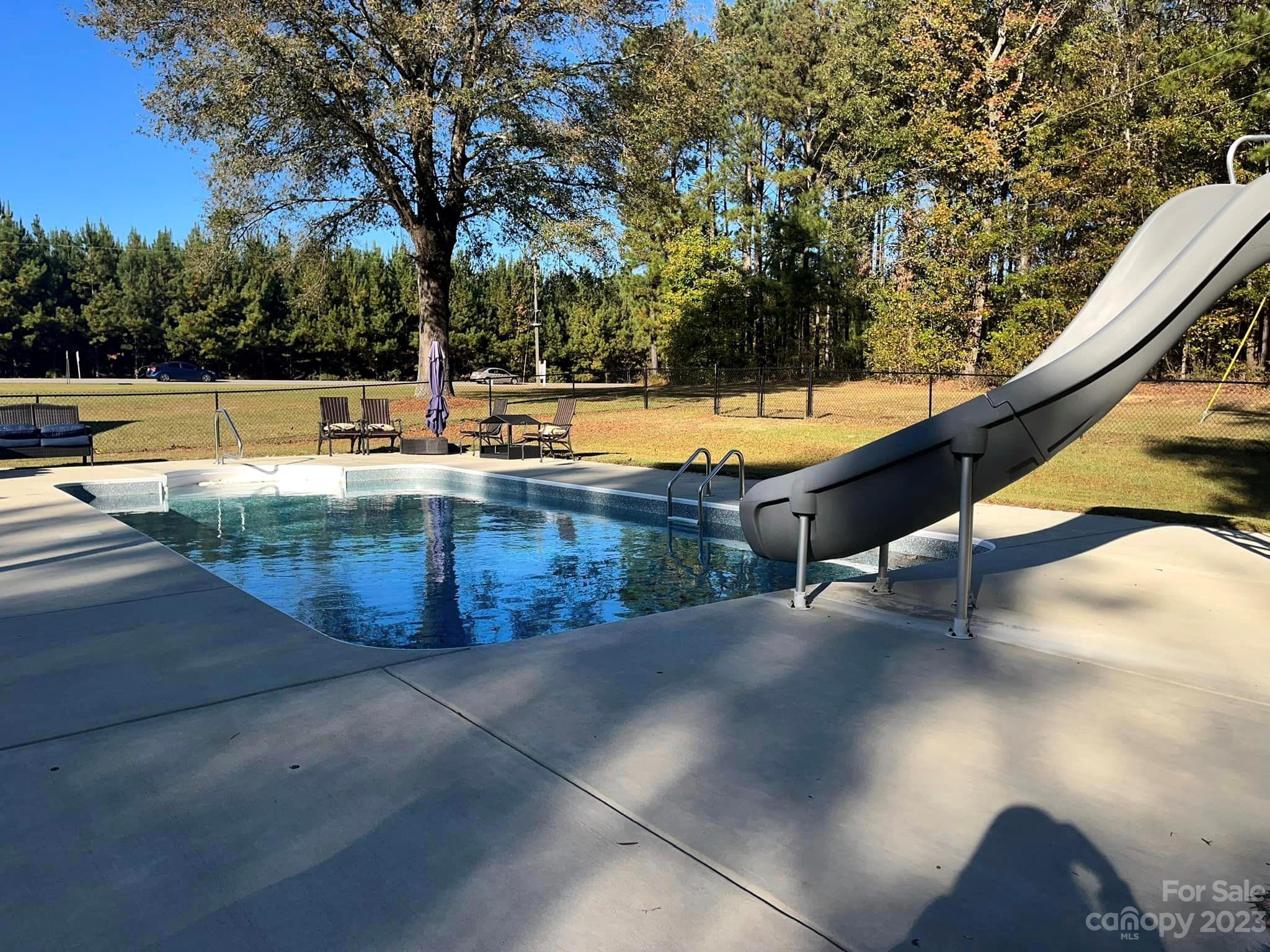 20909 Highway 9 Mount Croghan, SC 29727 - Photo 7 of 21 a view of a swimming pool with a patio