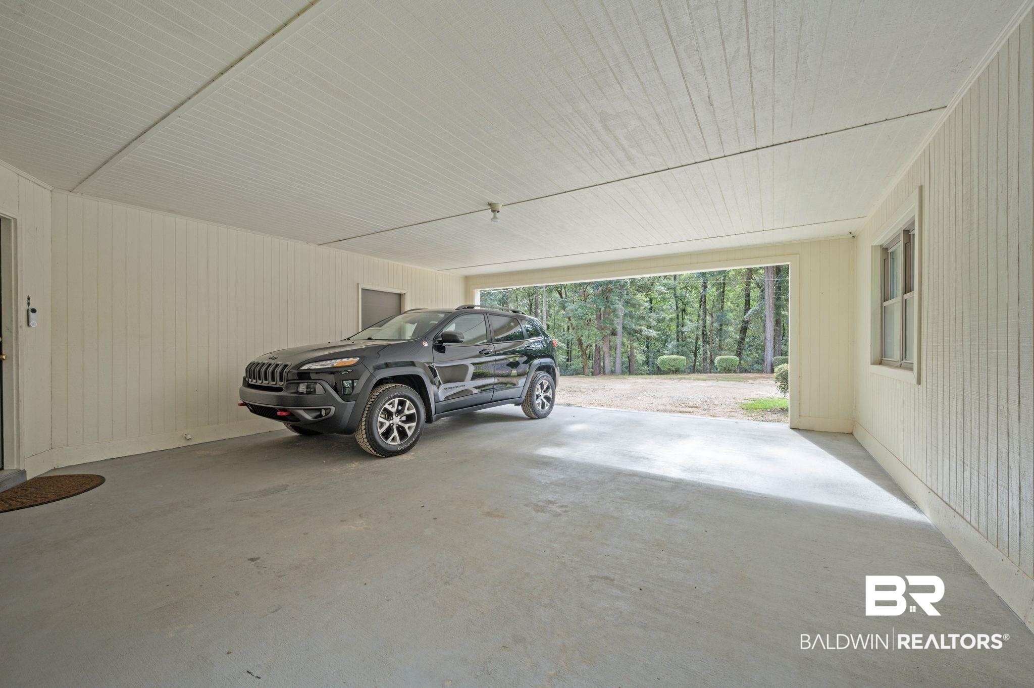 4566 McCrary Road, Unit A Semmes, AL 36575 - Photo 27 of 28 Garage featuring wood walls