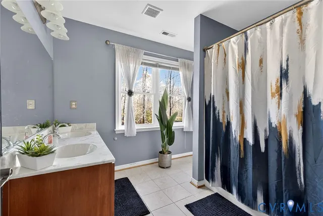 a view of a hallway to a livingroom with furniture