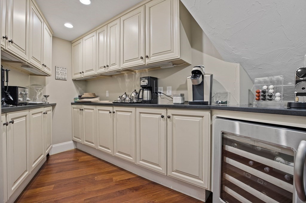 352 Clapp Road Scituate, MA 02066 - Photo 13 of 41 a kitchen with white cabinets and appliances