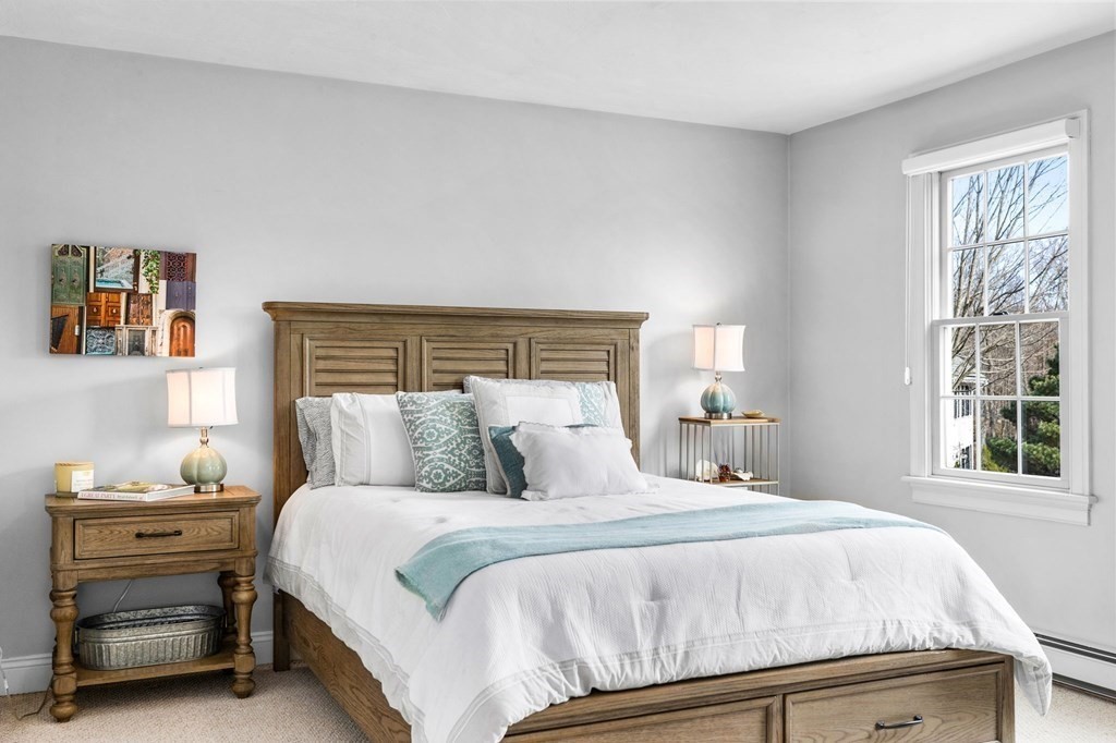 352 Clapp Road Scituate, MA 02066 - Photo 17 of 41 a bedroom with a bed and a window