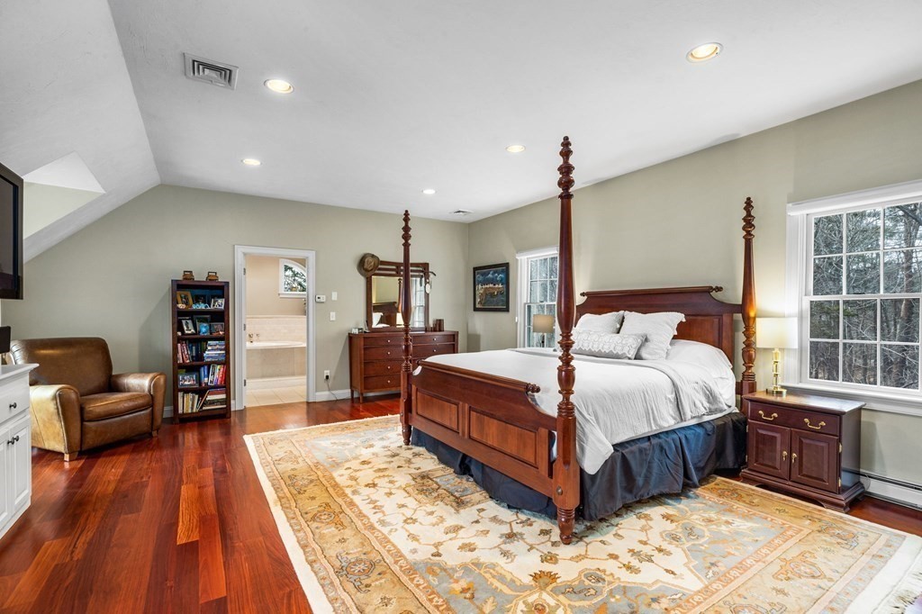 352 Clapp Road Scituate, MA 02066 - Photo 24 of 41 a bedroom with a bed and wooden floor