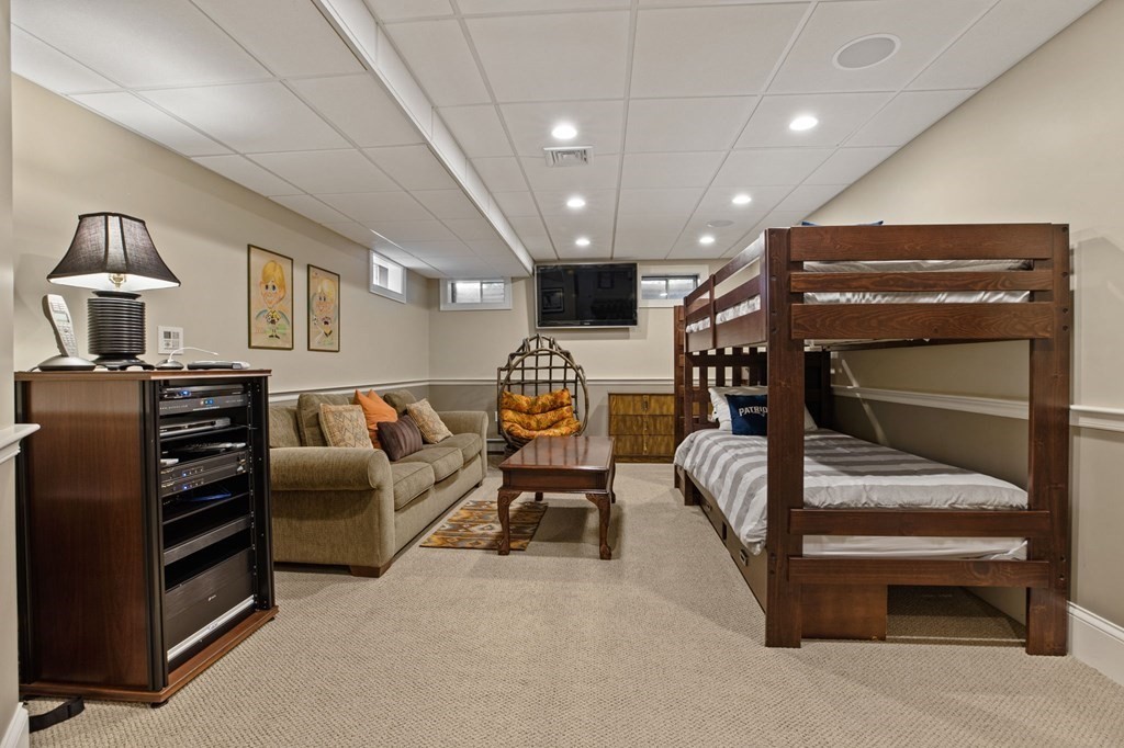 352 Clapp Road Scituate, MA 02066 - Photo 31 of 41 a bedroom with furniture and a ceiling fan