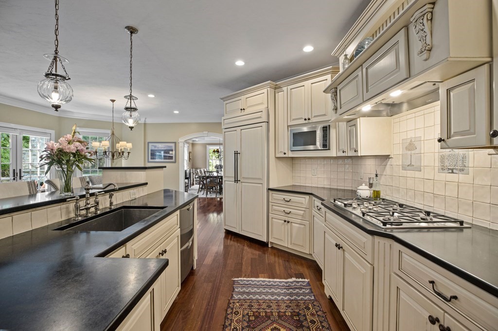 352 Clapp Road Scituate, MA 02066 - Photo 10 of 41 a kitchen with stainless steel appliances granite countertop a sink stove and refrigerator