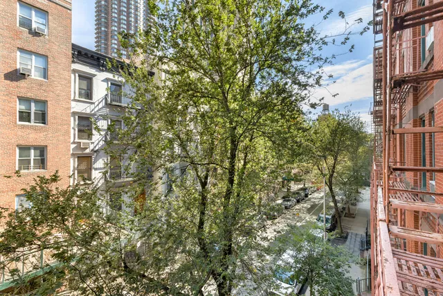 a view of a back yard from a balcony