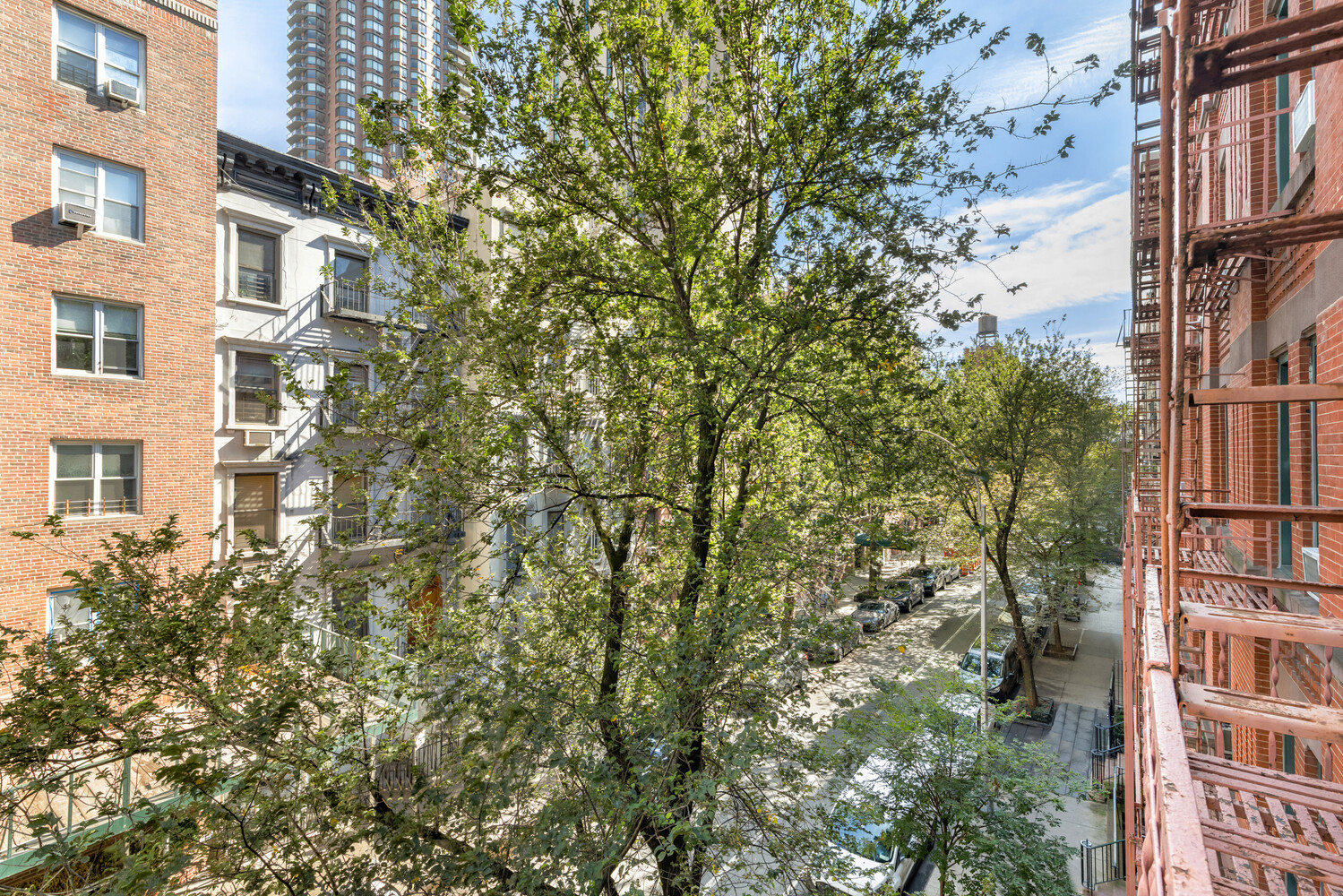 332 East 77th Street, Unit 11 Manhattan, NY 10075 - Photo 9 of 11 a view of a buildings with a tree