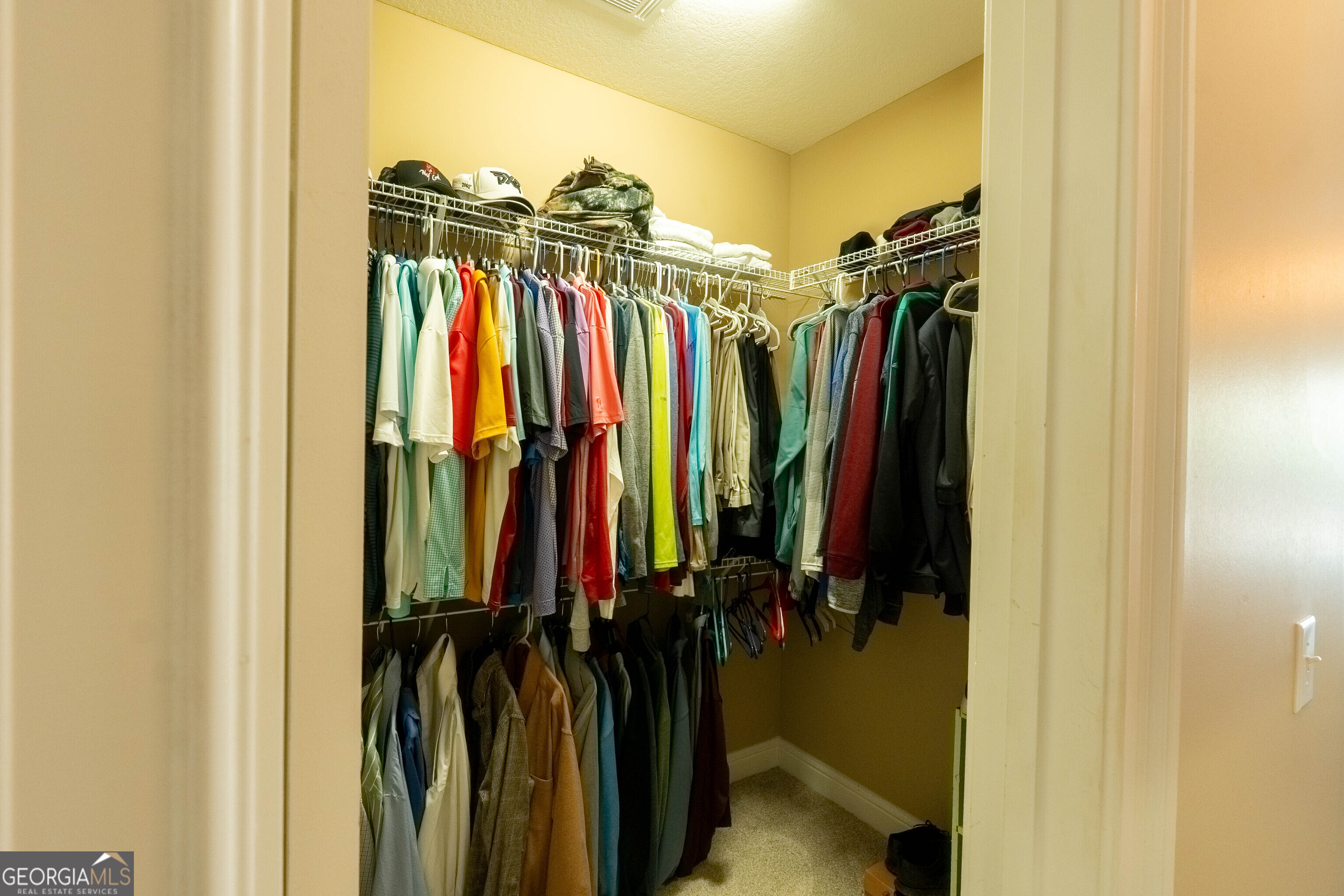 501 Old Bridge Road Warner Robins, GA 31088 - Photo 40 of 54 a view of walk in closet with clothes