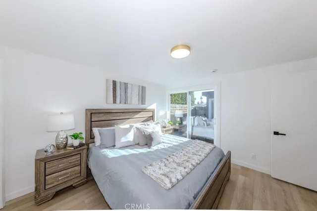 a bedroom with a bed and a table