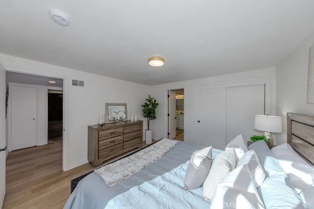 a bedroom with a bed and a cabinets