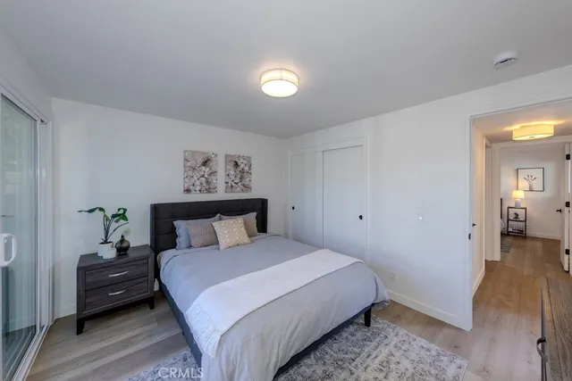 a bedroom with a bed and a lamp