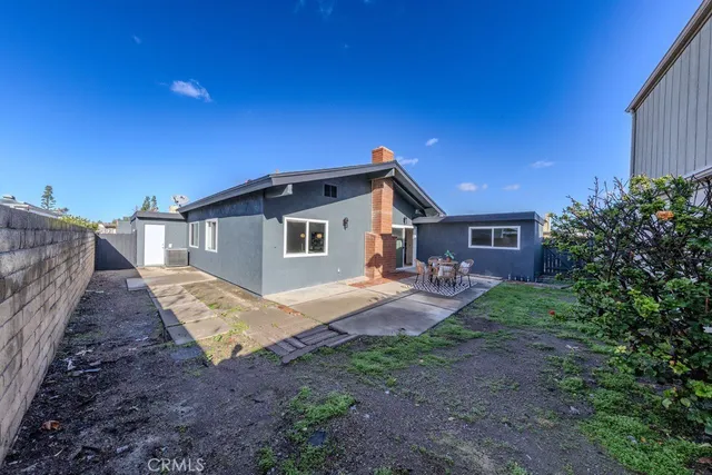a view of a patio with a yard
