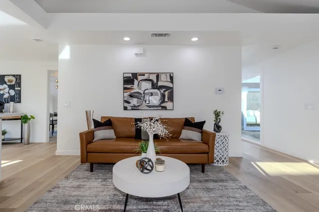 a living room with furniture and a rug