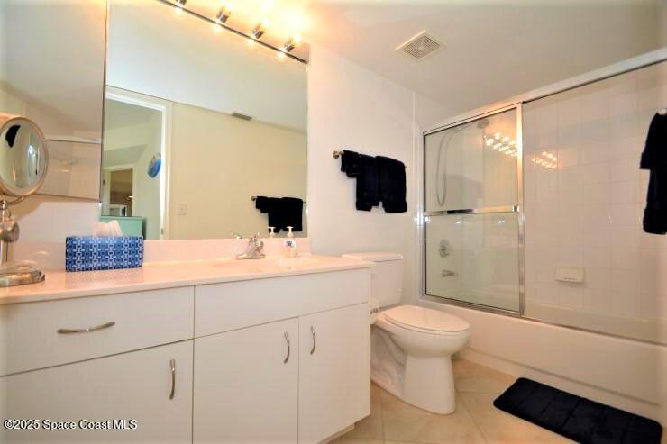 8700 Ridgewood Avenue, Unit B310 Cape Canaveral, FL 32920 - Photo 20 of 23 a bathroom with a sink a toilet and shower