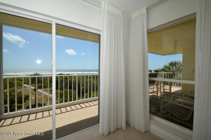 8700 Ridgewood Avenue, Unit B310 Cape Canaveral, FL 32920 - Photo 22 of 23 a view of a glass door with a glass door