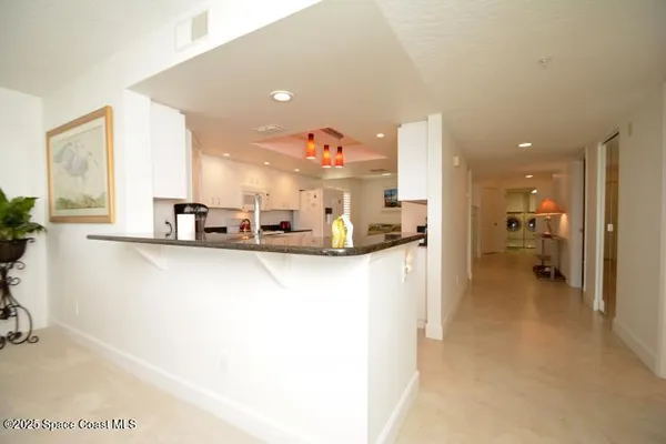 a view of a very nice looking living room with a large window