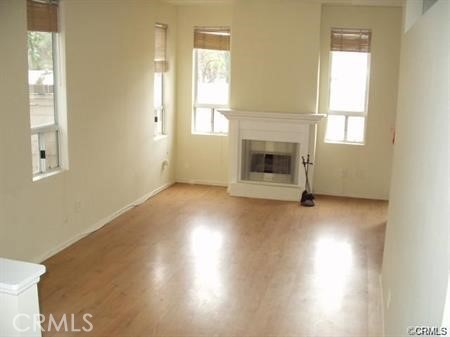 4815 South Fork Road Chino, CA 91710 - Photo 3 of 18 a view of empty room with wooden floor and fan