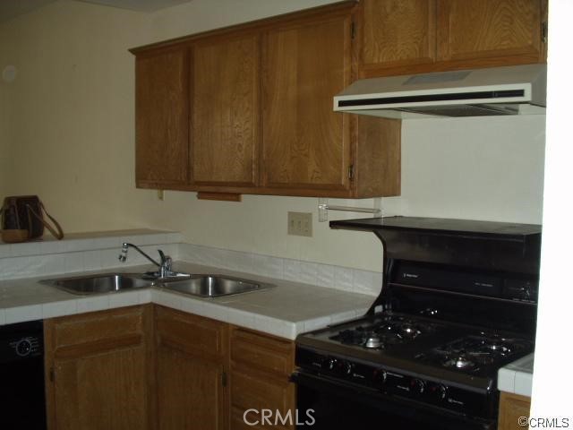 4815 South Fork Road Chino, CA 91710 - Photo 5 of 18 a kitchen with a stove and a sink