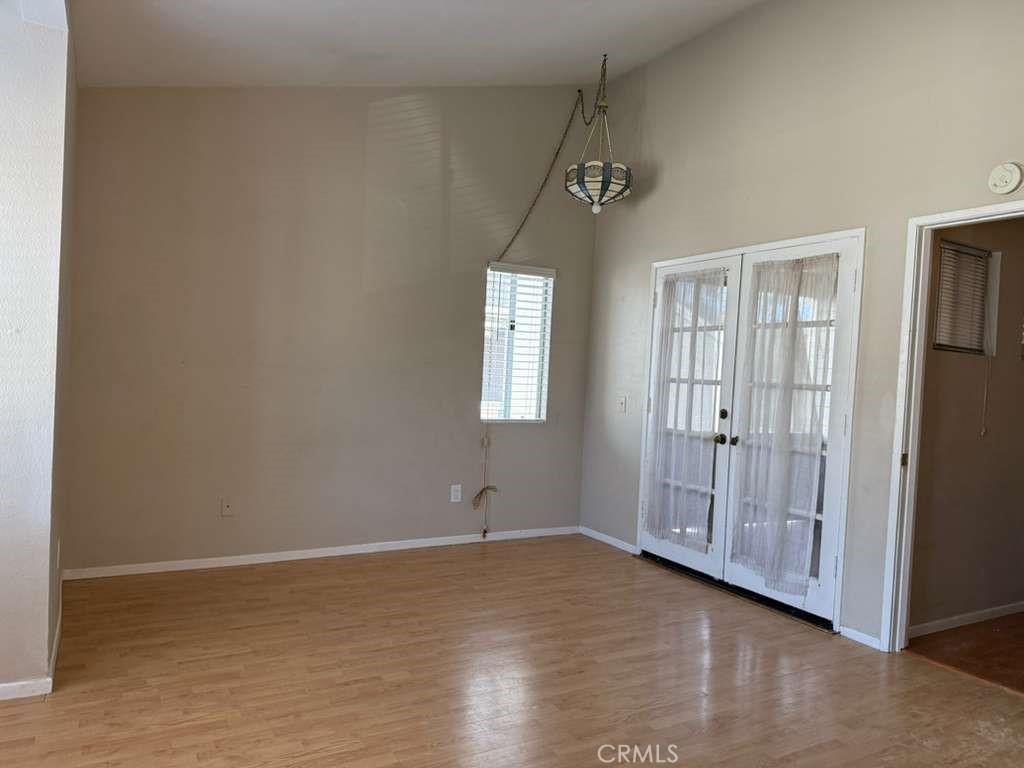 4815 South Fork Road Chino, CA 91710 - Photo 8 of 18 a view of an empty room with wooden floor and a window