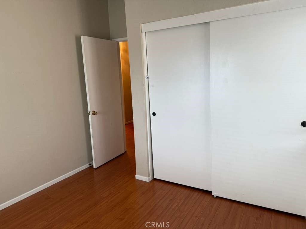 4815 South Fork Road Chino, CA 91710 - Photo 9 of 18 an empty room with wooden floor and closet