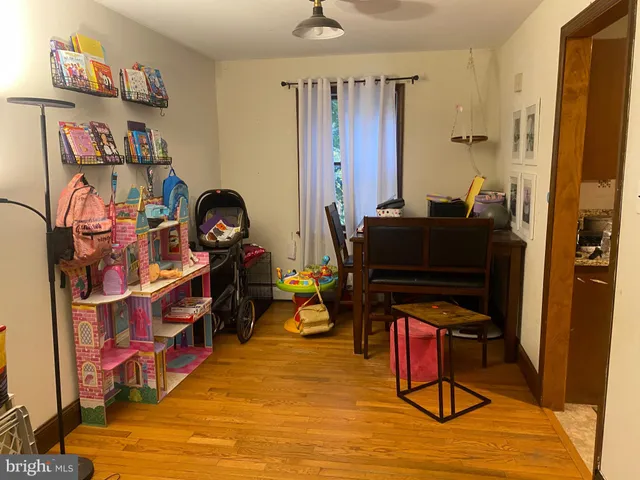 a bedroom with furniture and a book shelf