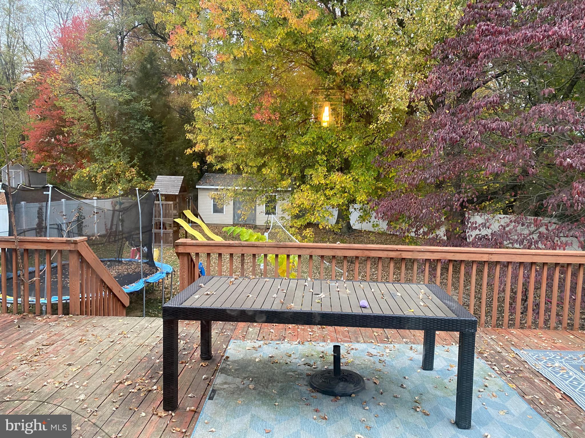 2414 Church Road Cinnaminson, NJ 08077 - Photo 17 of 22 a view of a roof deck with wooden fence and a couple of chairs