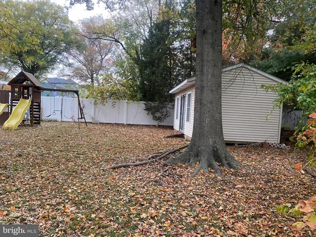 a front view of house with a garden
