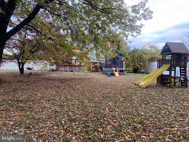 a view of a park with swings and slides