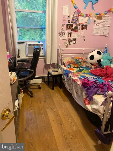 a bed room with a bed and a window