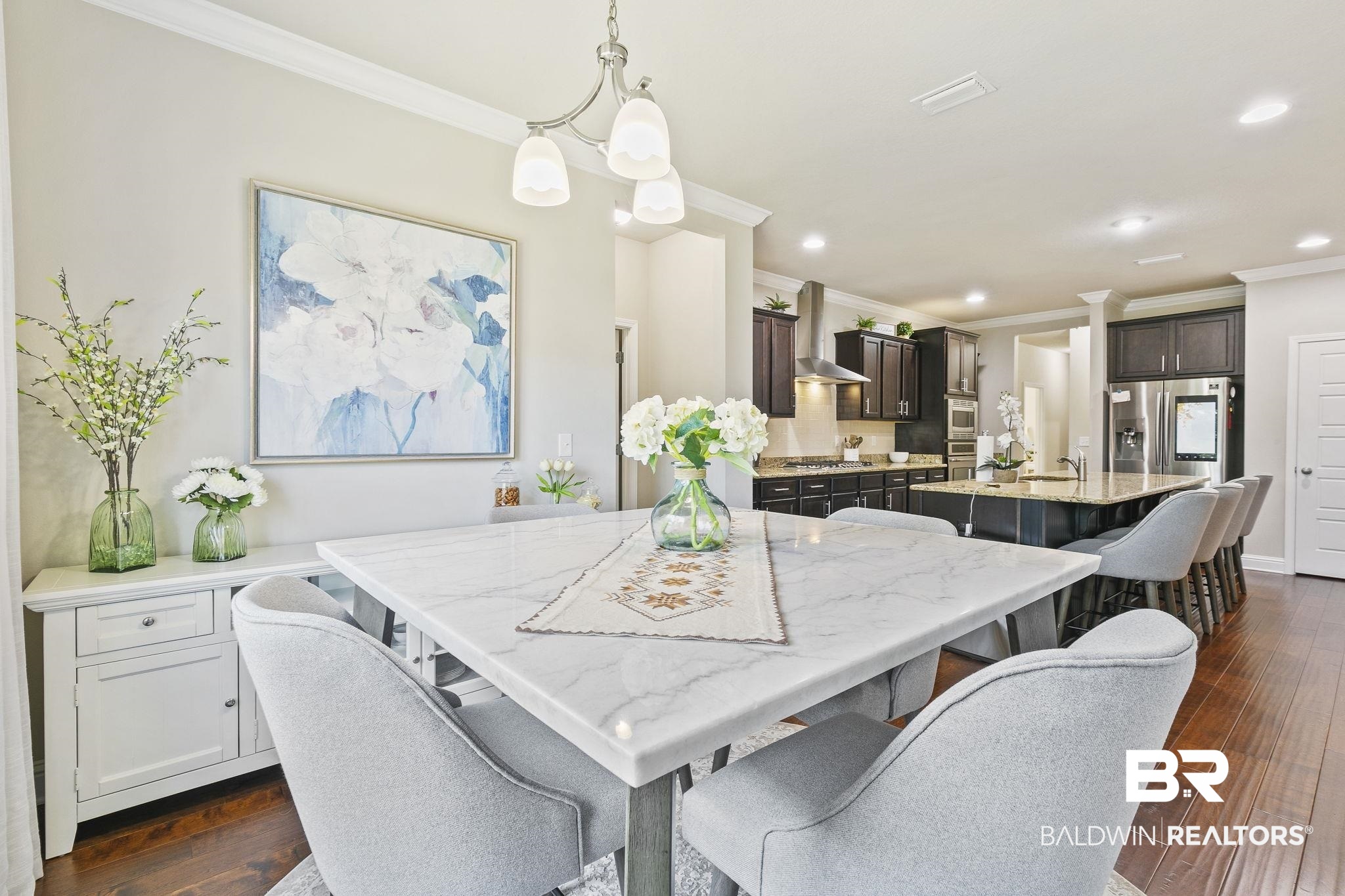 31500 Spoonbill Road Daphne, AL 36527 - Photo 24 of 85 Dining space featuring ornamental molding, dark hardwood / wood-style flooring, sink, and a chandelier