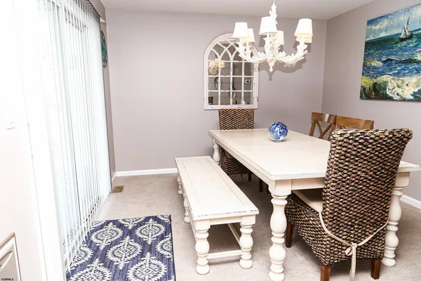 a view of a swimming pool with seating space