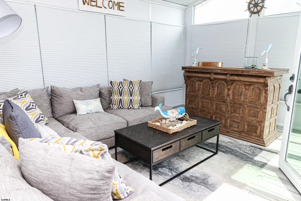 a view of swimming pool with outdoor seating and yard in back