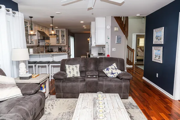 a kitchen with a stove a sink and a refrigerator