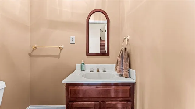 a view of a bathroom with a sink and a mirror