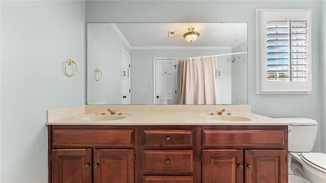a bathroom with a sink a vanity and a mirror