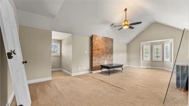 a view of room with workspace and a window